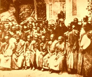 Col. Olcutt and a group of monks